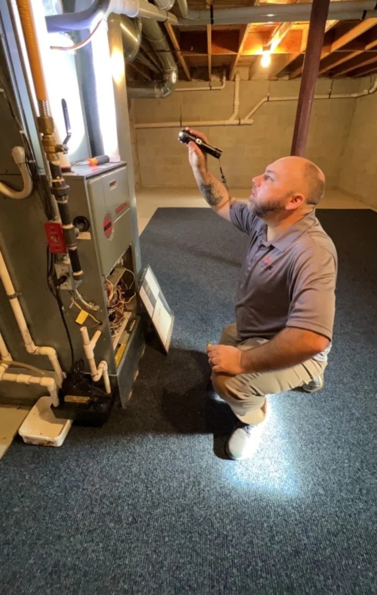 Mike examining equipment during an inspection