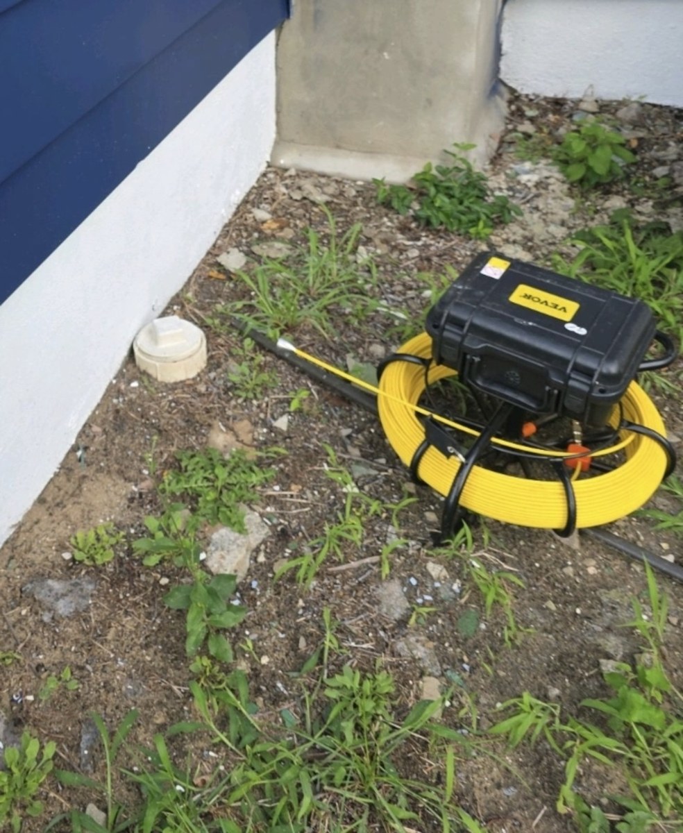 Sewer scope inspection equipment beside a home